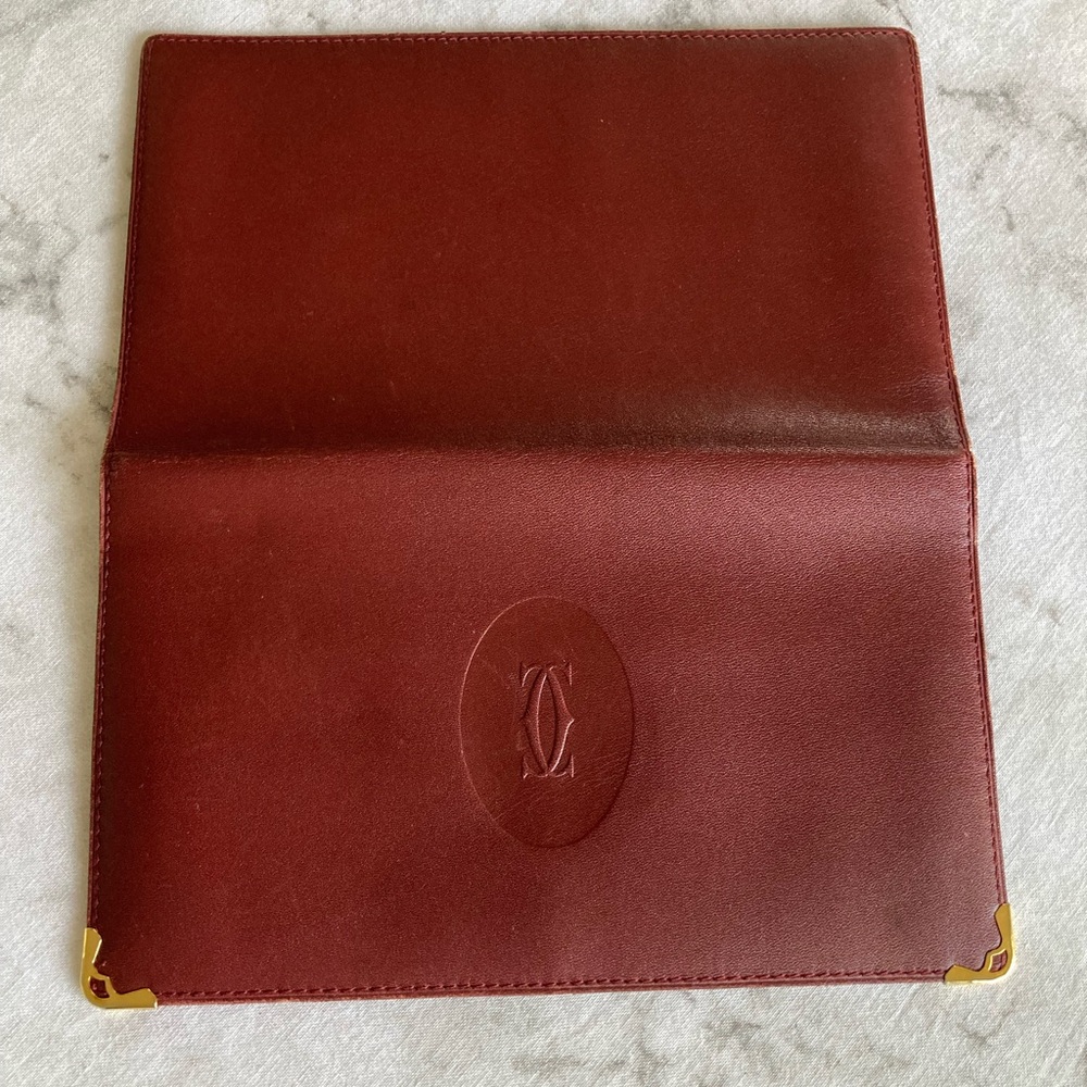 Cartier Paris international bifold burgundy wallet